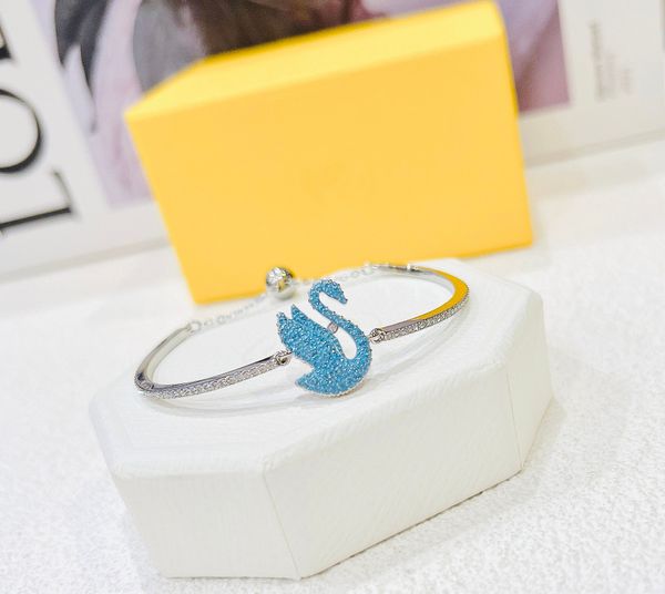  Lắc tay Swarovski thiên nga tung cánh new màu xanh biển - Swarovski Iconic Swan bangle Swan, Blue, Rhodium plated 