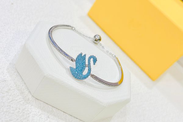  Lắc tay Swarovski thiên nga tung cánh new màu xanh biển - Swarovski Iconic Swan bangle Swan, Blue, Rhodium plated 
