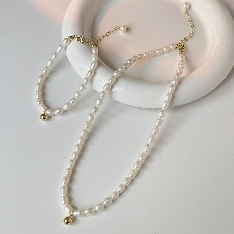 Bộ Trang Sức Gồm Vòng Cổ và Vòng Tay Ngọc Trai Hạt Gạo Đính Tua Rua Chuông Vàng MADAME HIEN PEARLS Đáng Yêu SCG011