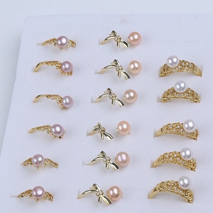 Nhẫn Hình Nút Ngọc Trai Tự Nhiên Hình Nơ Freesize NN031H