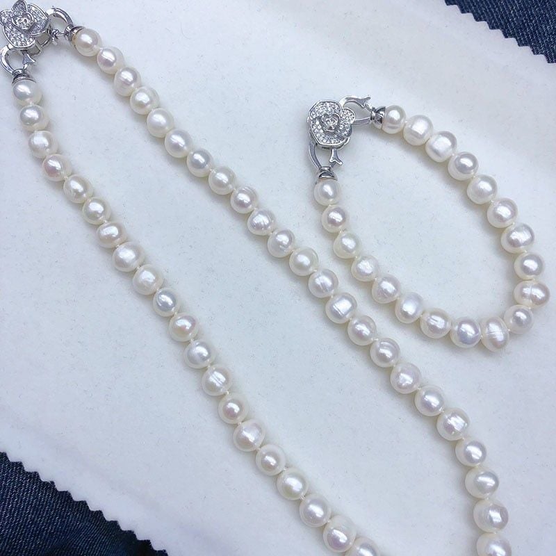 Bộ Set Ngọc Trai Vòng cổ và Vòng Tay Trắng Tự Nhiên Khoá Hoa Trà 3 Cánh MADAME HIEN PEARLS SCT036