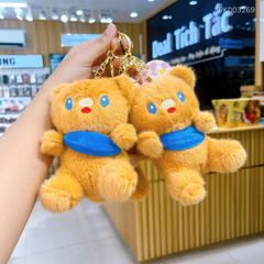 ** Móc khóa Gấu nâu túi xanh