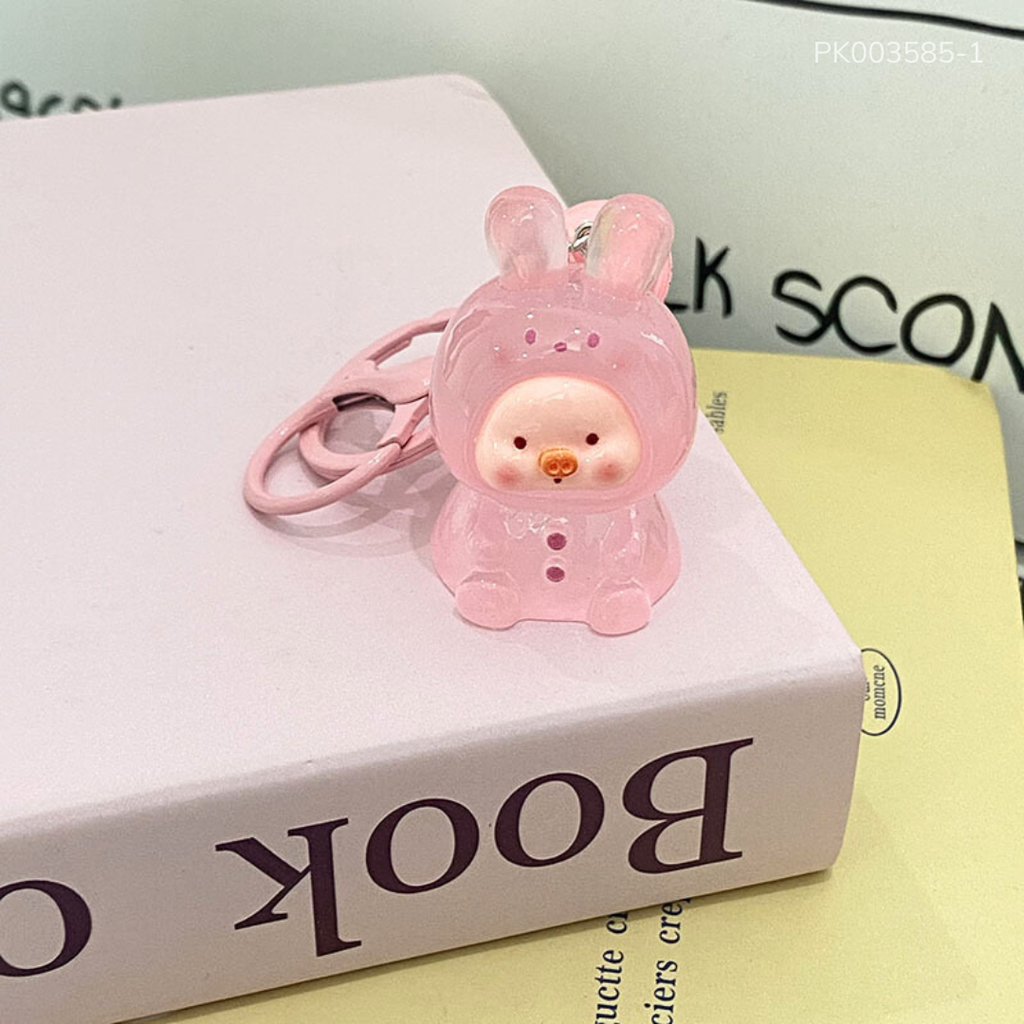 ** Móc khóa Charm Heo màu trong