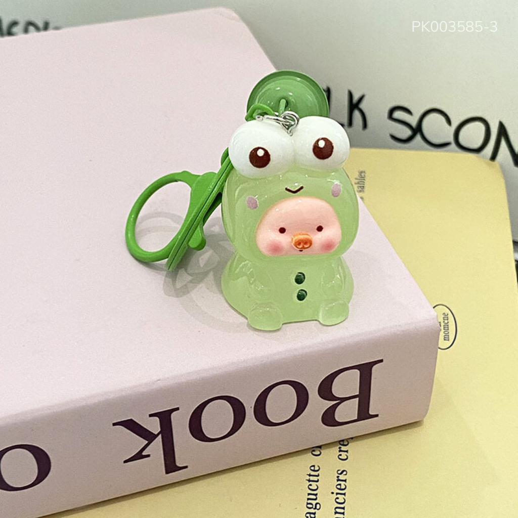 ** Móc khóa Charm Heo màu trong