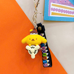 ** Móc khóa cún vàng ngồi máy bay nâu