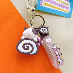 ** Móc khóa mèo ôm bánh