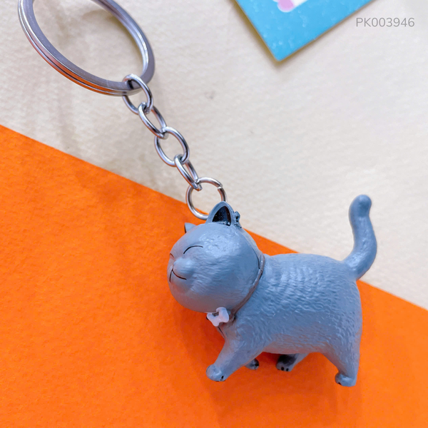 ** Móc khóa mèo xám đeo nơ