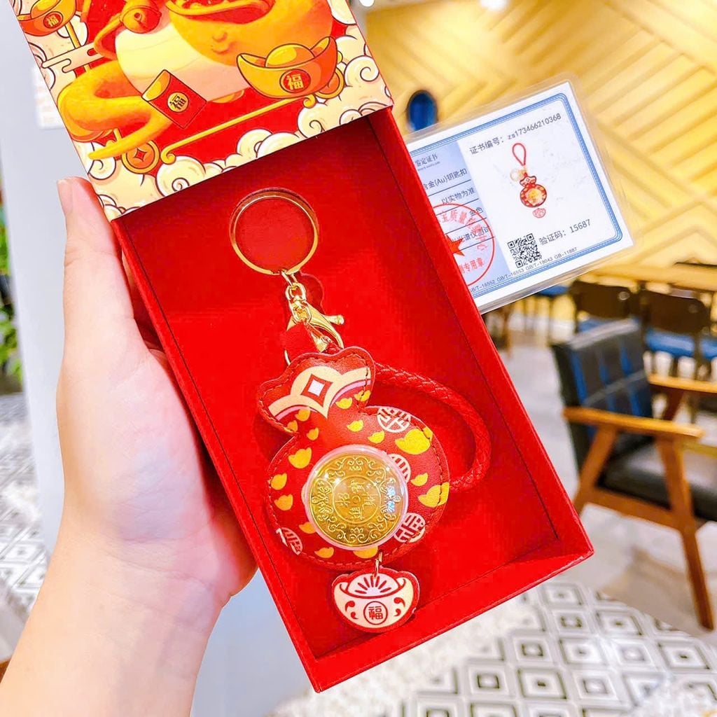 ** Móc khóa da mèo thần tài đồng xu xoay