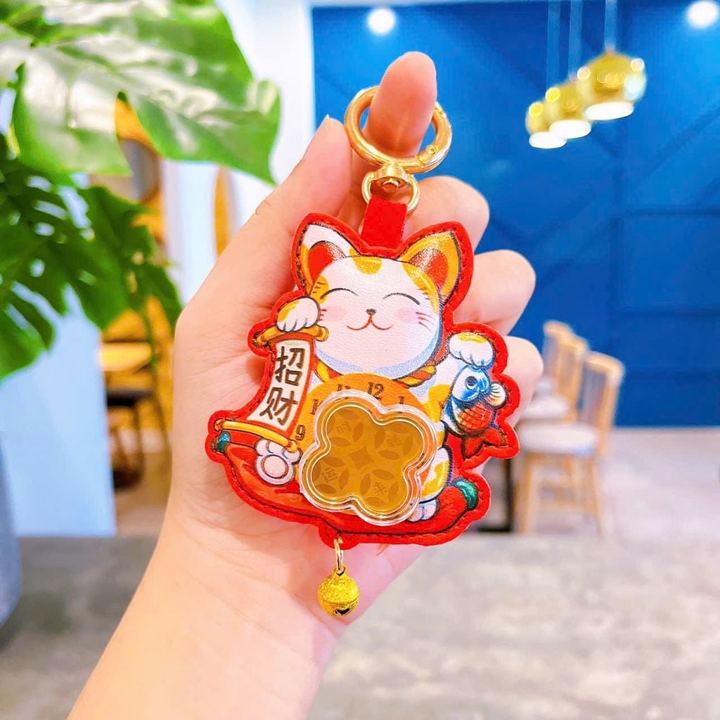 ** Móc khóa da túi tiền đỏ xoay đồng xu