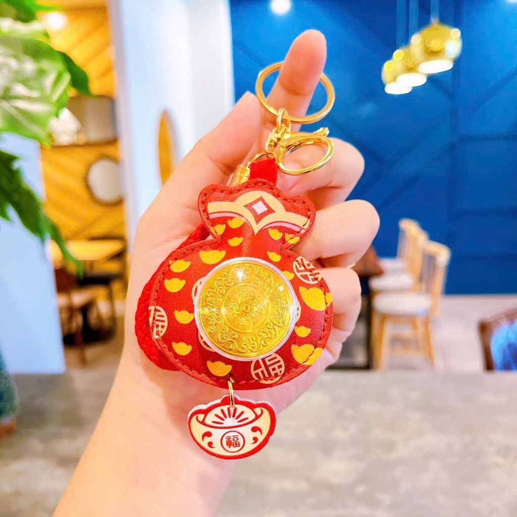** Móc khóa da mèo thần tài đồng xu xoay