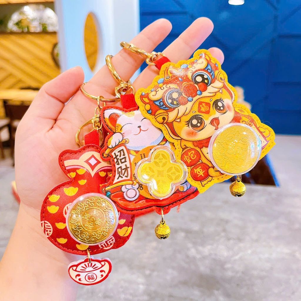 ** Móc khóa da rắn lân đồng xu xoay