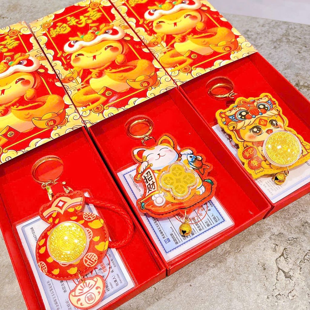 ** Móc khóa da rắn lân đồng xu xoay