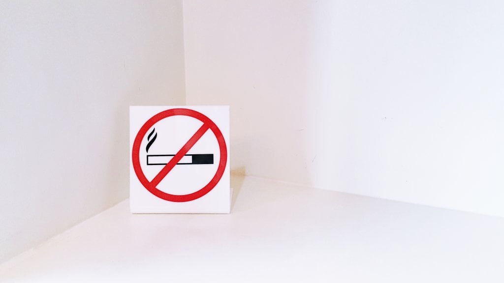 No-smoking-sign-on-white-table-background-2022-11-04-00-43-22-utc