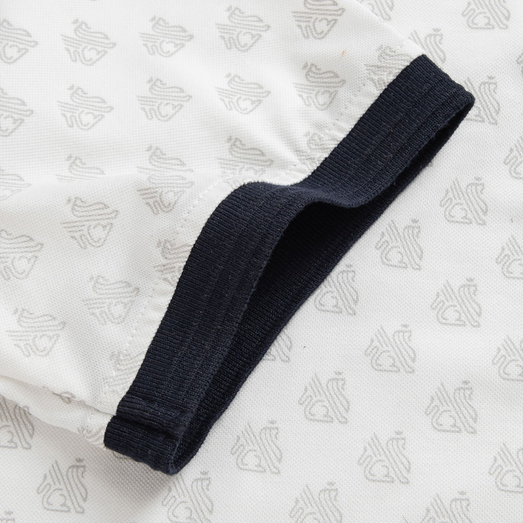  Áo polo monogram in tràn họa tiết GSTP051 