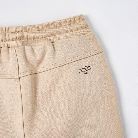  Quần dài màu be thêu đáp gối trang trí 