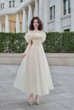  Váy kem dài bẹt vai đính bông LOVELYN 