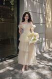  Váy vàng 2 nơ bên tay tà 3 tầng LOVELYN 