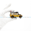 Mô hình xe Land Rover Defender 110 1989 Camel Trophy Amazon 1:64 MiniGT