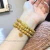  Chuỗi Vòng Thạch Anh Tóc Vàng Vip 6.2ly Túi Tiền Kim Bảo Mix Ngũ Điếu Và Charm Chú Om Mani Padme Hum Vàng Trang Sức (Kim, Thổ) 1-122003 