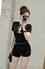 Jumsuit cộc tay phối nút và xích kèm  - T235