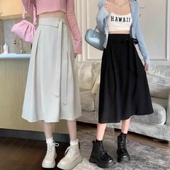 CHÂN VÁY XẾP LY A DÁNG DÀI CỘT NƠ LỆCH