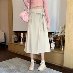 CHÂN VÁY XẾP LY A DÁNG DÀI CỘT NƠ LỆCH