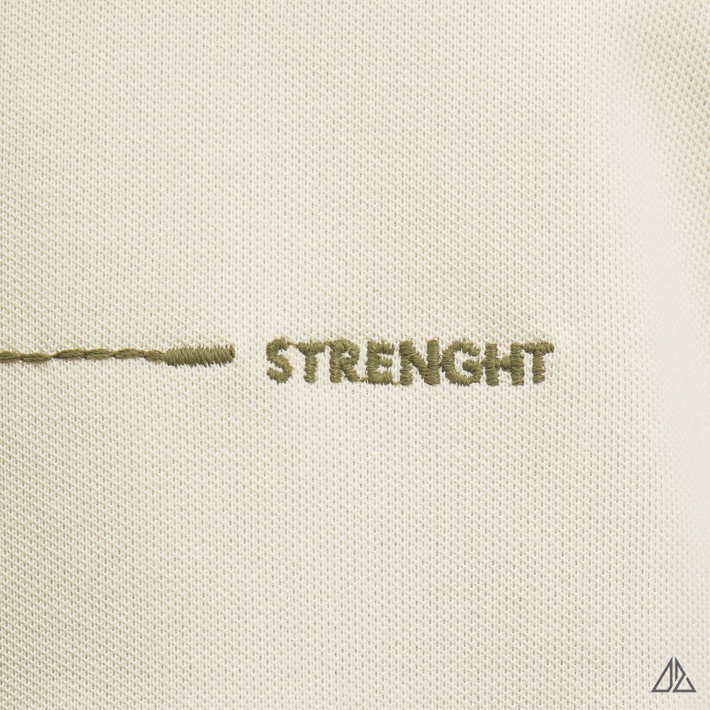 Áo polo đắp ngực kem đen thêu chữ STRENGHT