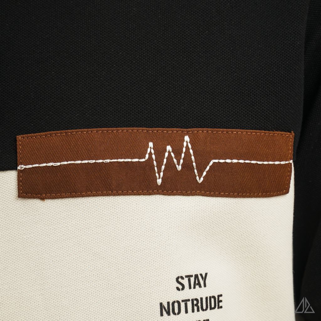 Áo polo phối ngực kem in chữ STAY NOTRUDE NICE