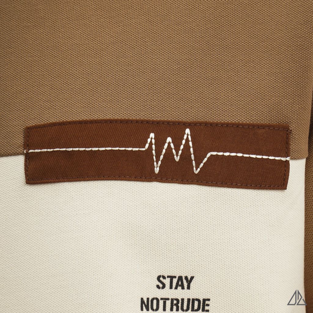 Áo polo phối ngực kem in chữ STAY NOTRUDE NICE