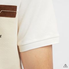 Áo polo phối ngực kem in chữ STAY NOTRUDE NICE