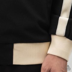 Áo khoác cổ đứng phối viền sọc thêu chữ M