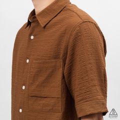 Áo sơ mi tay lững, vải dập nổi