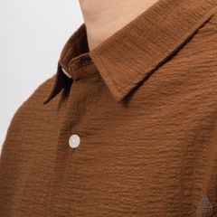 Áo sơ mi tay lững, vải dập nổi