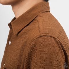 Áo sơ mi tay lững, vải dập nổi