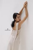  Đầm 2 dây gài nút sau lưng kem 