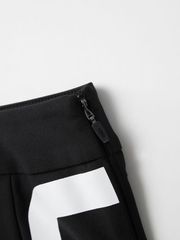 UTAA Slide Bulk Logo Pleats Skirt: Black