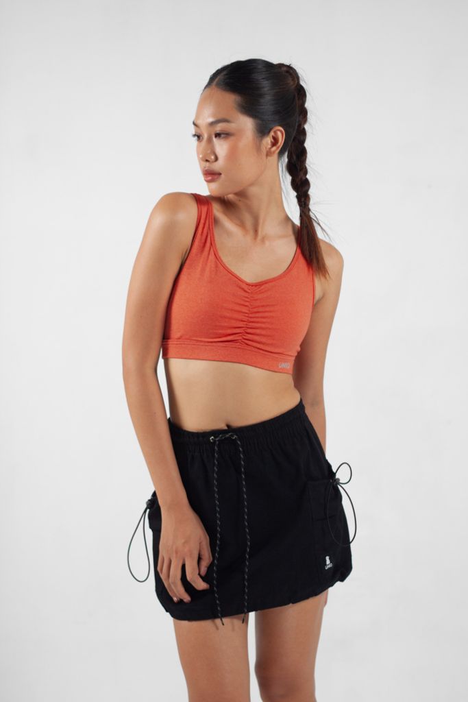 UniqFit Áo Tập Nữ Cool Peel Nhún Ngực Vàng Cam