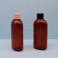 Chai nhựa pet thân oval nâu đỏ 500ml đầu bơm kem nắp bật