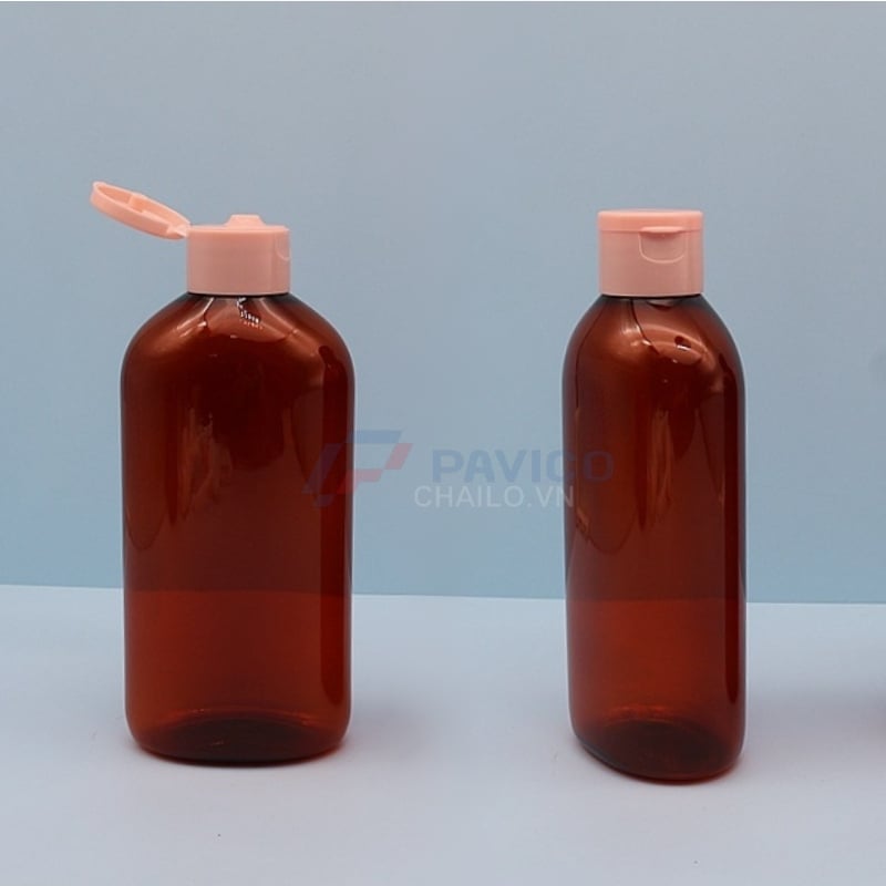 Chai nhựa pet thân oval nâu đỏ 500ml đầu bơm kem nắp bật