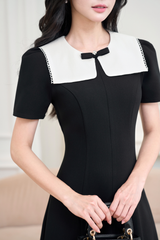 Váy đen dài cổ đắp phối ren trắng đính nơ đá YAME YV666