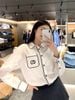  Sơ mi trắng , viền đen. túi ngực CC 