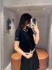  Áo phông đen chữ viền cổ cong CH 