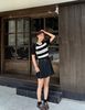  Chân váy ngắn xòe đen, kèm Belt da 