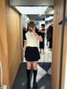  Chân váy ngắn xếp ly 2 túi giả - đen 