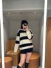  4.Áo len đen trắng kẻ ngang 