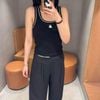  Áo tanktop đen, gấu trắng 
