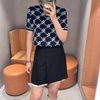  Chân váy xếp ly đen, viền gấu trắng 