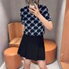  Chân váy xếp ly đen, viền gấu trắng 