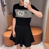  Chân váy xòe đen-logo nhỏ dưới cạp trái 