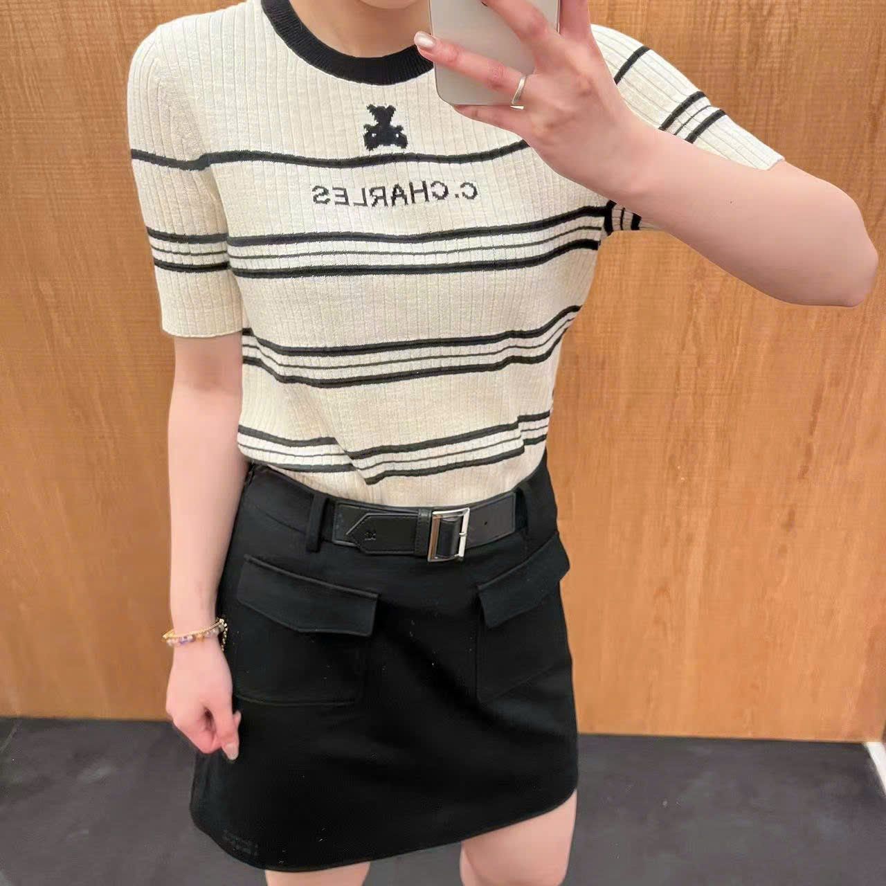  Chân váy chữ A đen, 2 túi trước kèm Belt da 
